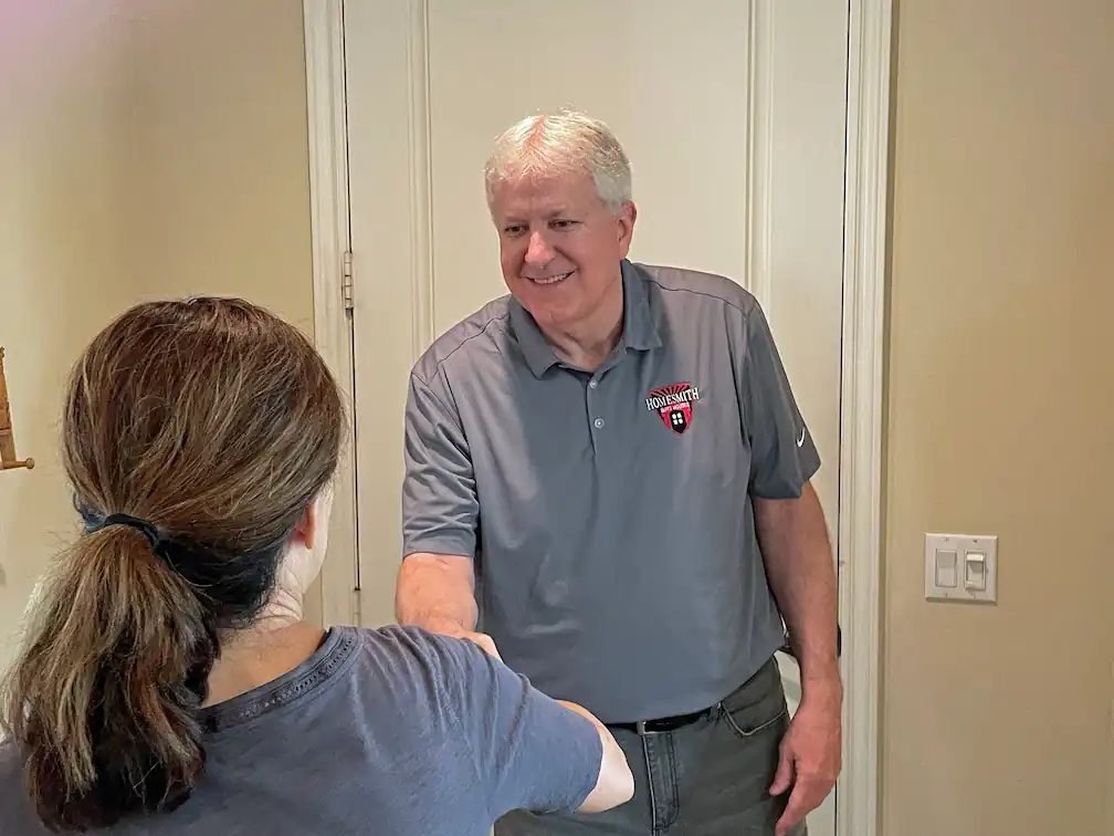 Barry Smith shaking hands with a customer after making a deal